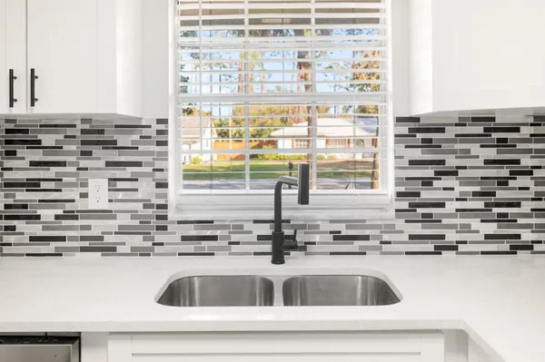 a close view of a sink and a window