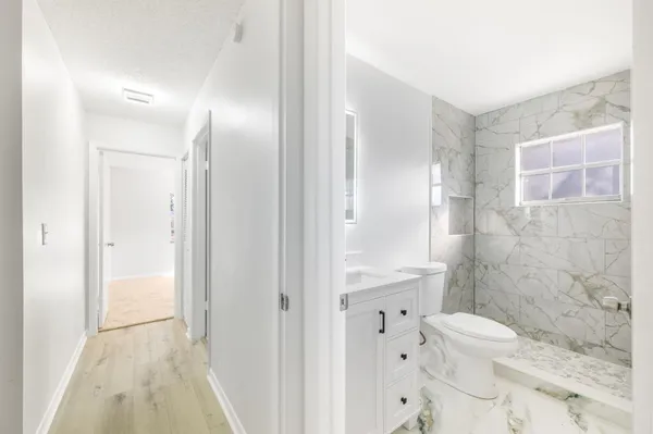 a bathroom with a shower and a toilet