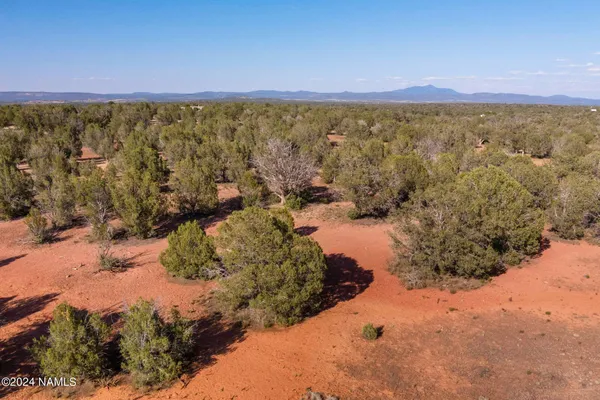 a view of a road with a building in the background