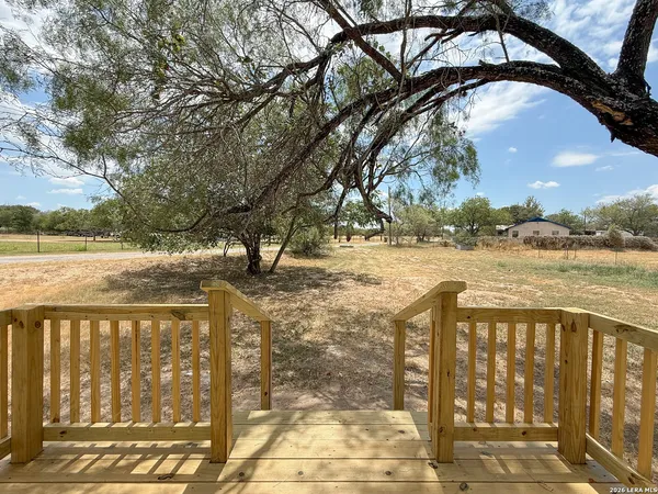 a view of lake with a yard