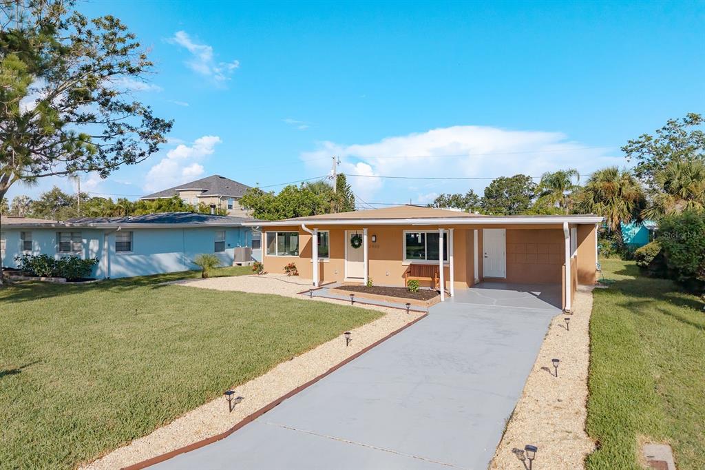 a front view of house with yard and seating area