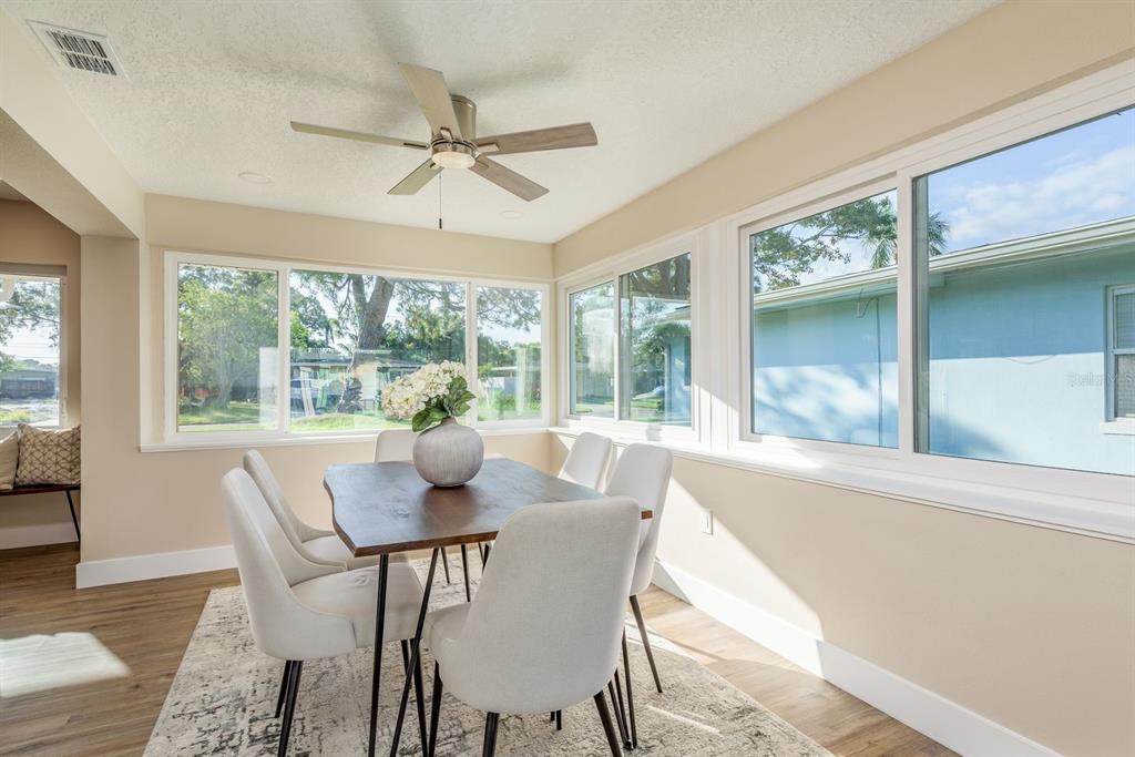 2480 Del Rio Way Dunedin, FL 34698 - Photo 13 of 35 a dining room with furniture window and outside view