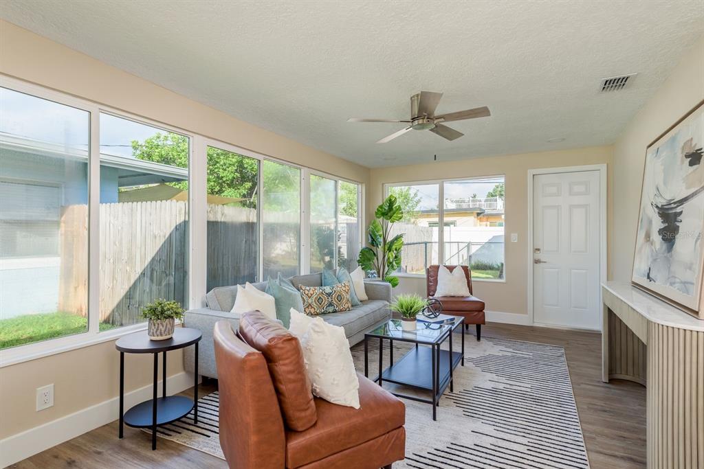 2480 Del Rio Way Dunedin, FL 34698 - Photo 14 of 35 a living room with furniture and a large window
