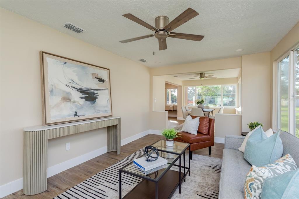 2480 Del Rio Way Dunedin, FL 34698 - Photo 15 of 35 a living room with furniture and a large window