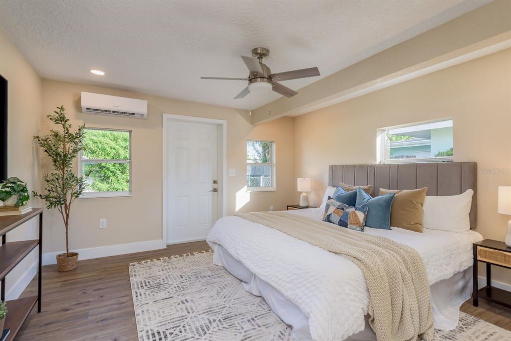 2480 Del Rio Way Dunedin, FL 34698 - Photo 16 of 35 a bedroom with a large bed and a window