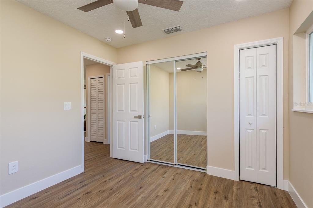 2480 Del Rio Way Dunedin, FL 34698 - Photo 20 of 35 wooden floor in an empty room