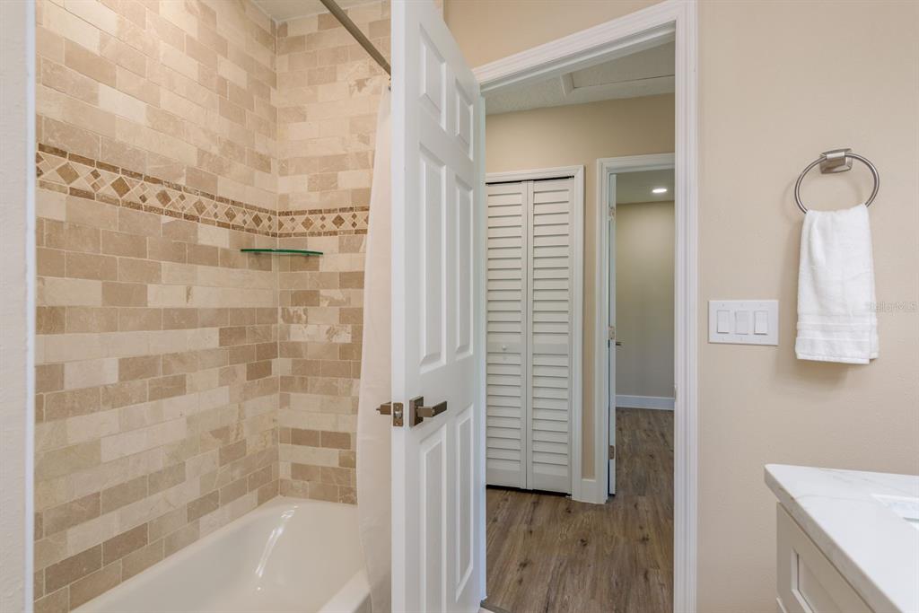 2480 Del Rio Way Dunedin, FL 34698 - Photo 22 of 35 a bathroom with a bathtub and shower