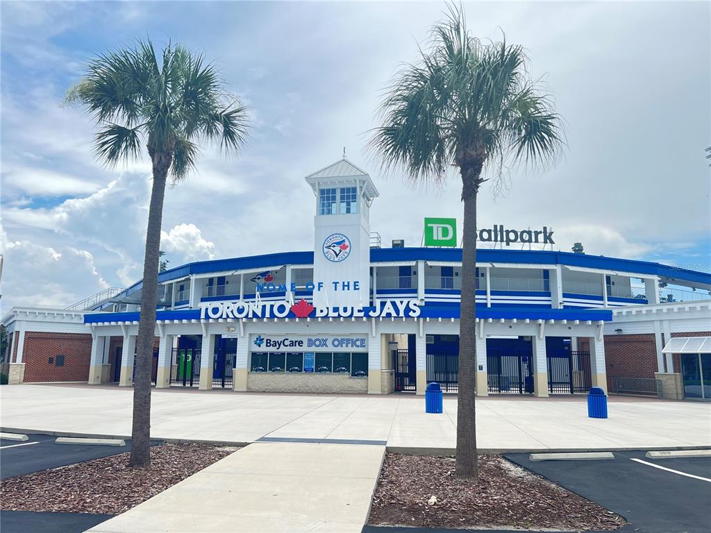 2480 Del Rio Way Dunedin, FL 34698 - Photo 35 of 35 a front view of a building with palm trees