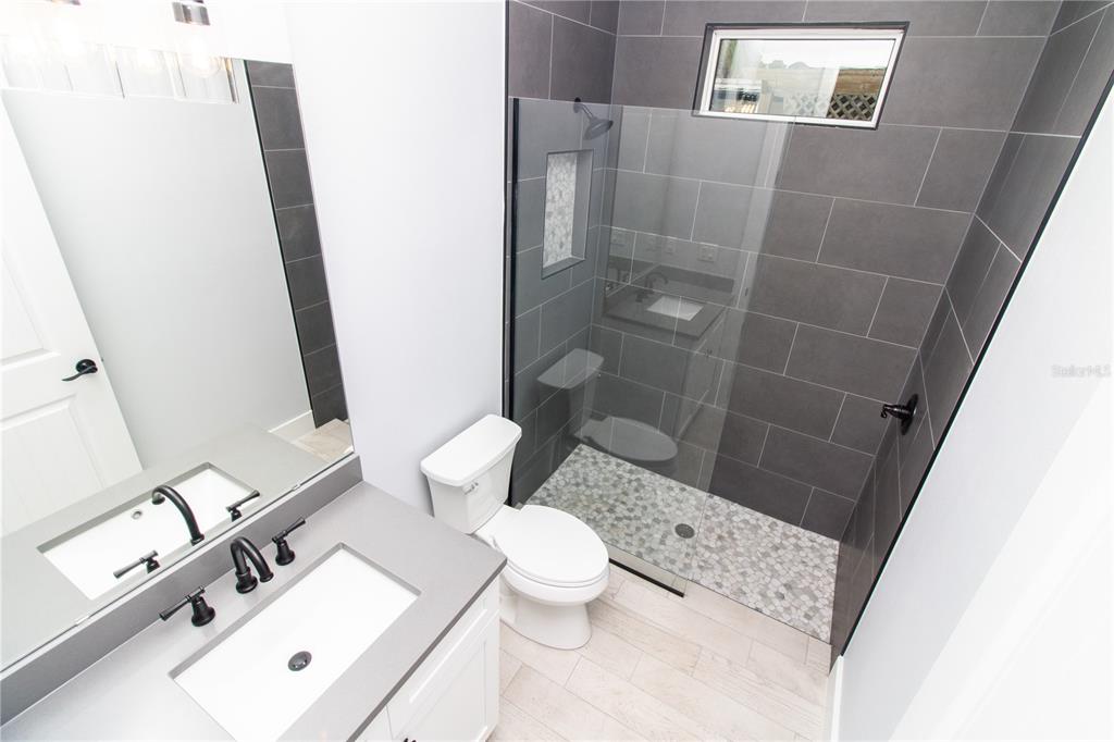 113 Douglas Street Edgewater, FL 32141 - Photo 12 of 39 a bathroom with a sink and a mirror