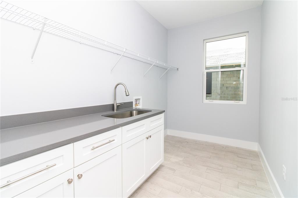113 Douglas Street Edgewater, FL 32141 - Photo 15 of 39 a kitchen with a sink and cabinets