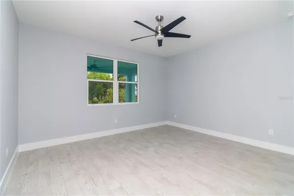 a bedroom with bed and a window