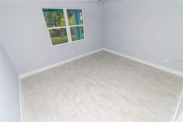 a bathroom with a double vanity sink a mirror and shower