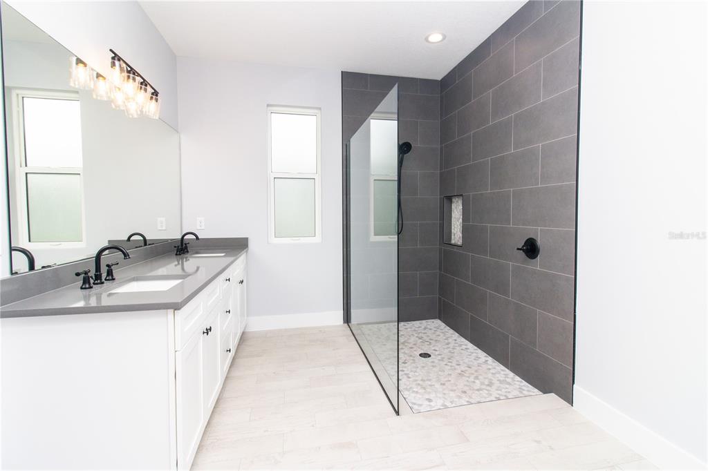 113 Douglas Street Edgewater, FL 32141 - Photo 26 of 39 a bathroom with a sink shower and a mirror
