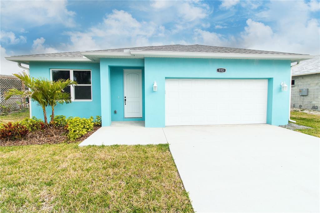 113 Douglas Street Edgewater, FL 32141 - Photo 39 of 39 a front view of a house with garden