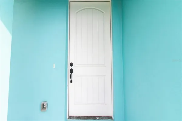 a view of bathroom with white door