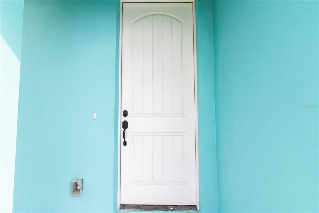 113 Douglas Street Edgewater, FL 32141 - Photo 7 of 39 a view of front door