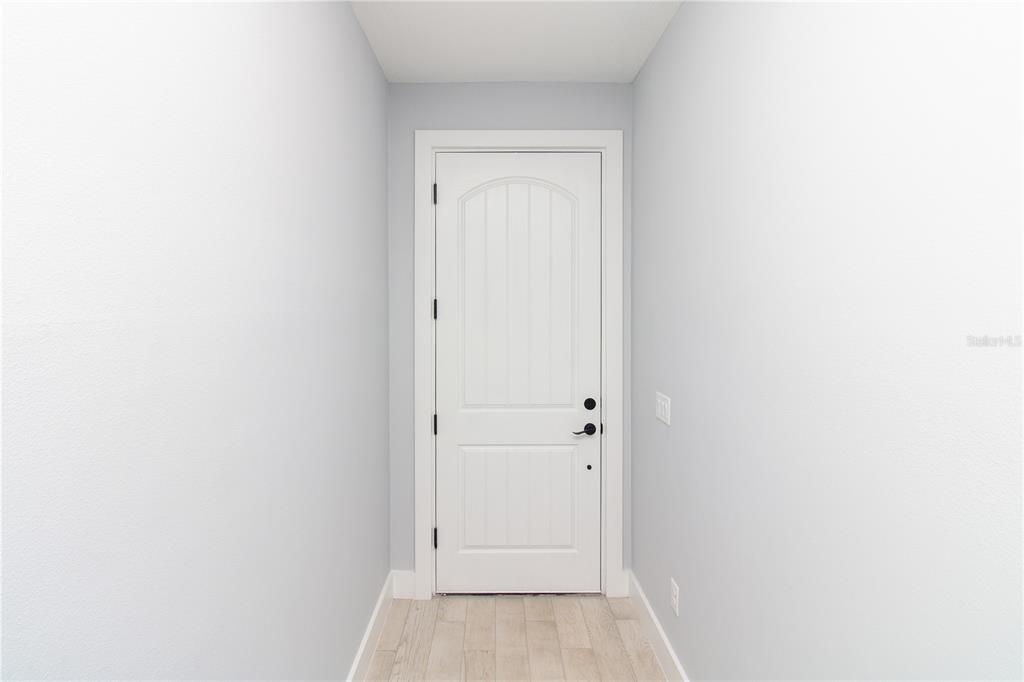 113 Douglas Street Edgewater, FL 32141 - Photo 8 of 39 a view of bathroom with white door