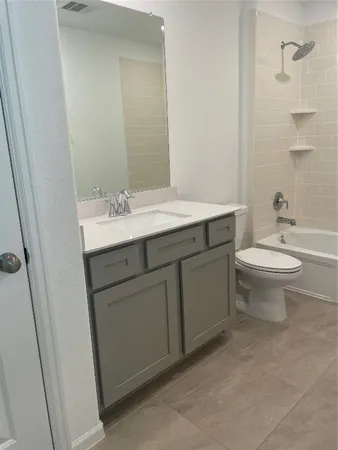 a bathroom with a sink toilet and mirror