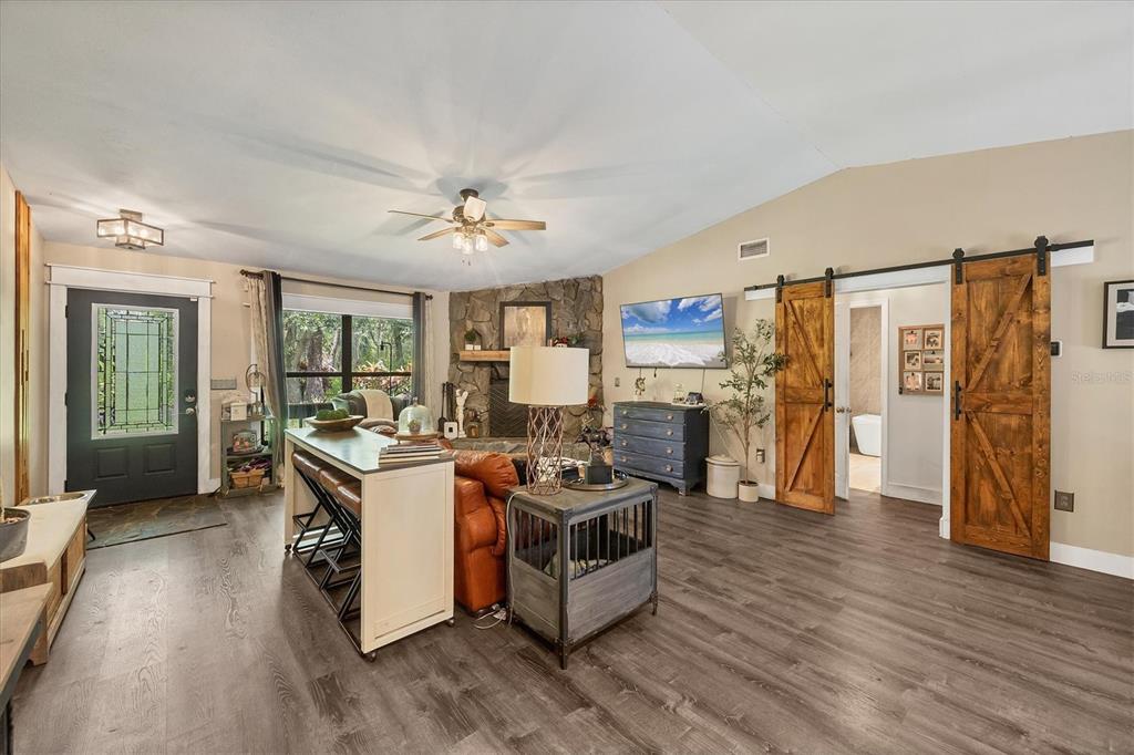 18155 Highway 62 Parrish, FL 34219 - Photo 12 of 61 a view of a kitchen with furniture and wooden floor