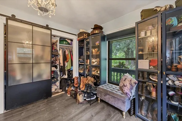 a living room with furniture and floor to ceiling windows
