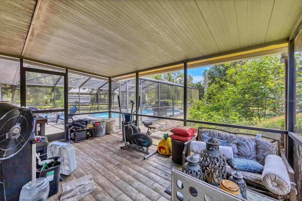 18155 Highway 62 Parrish, FL 34219 - Photo 32 of 61 a living room with furniture and a floor to ceiling window