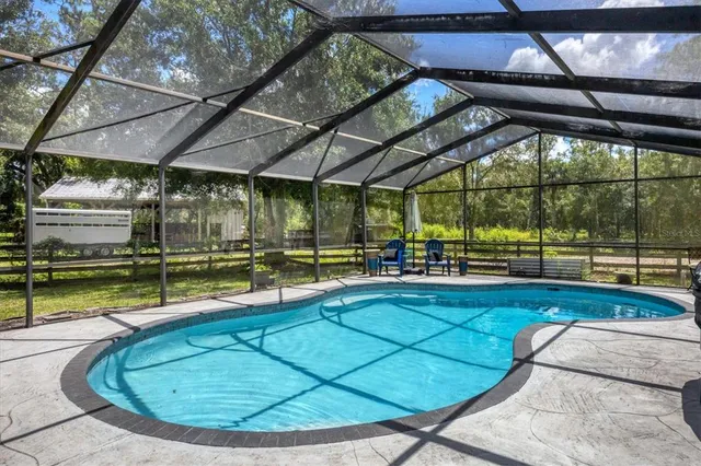 a view of a yard with a house in the background