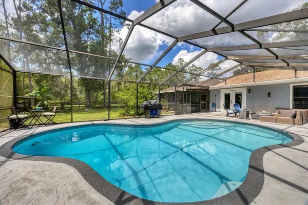 a backyard of a house with lots of green space