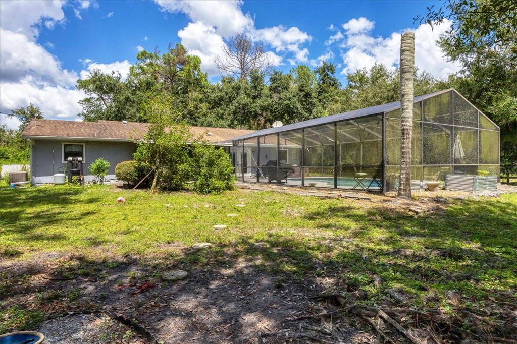 18155 Highway 62 Parrish, FL 34219 - Photo 42 of 61 a backyard of a house with table and chairs
