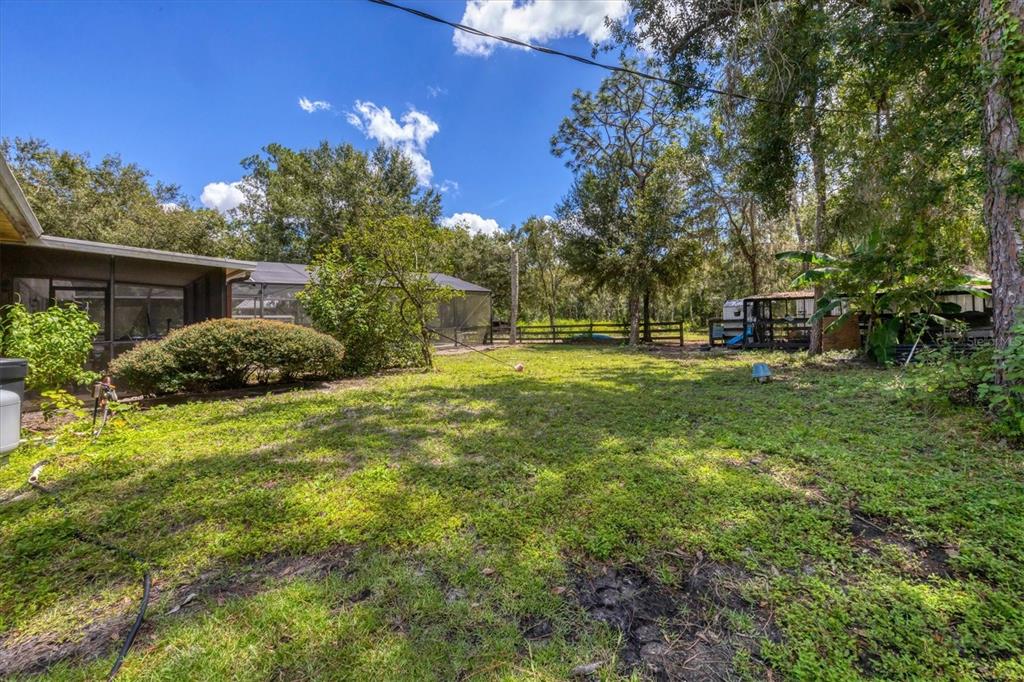 18155 Highway 62 Parrish, FL 34219 - Photo 43 of 61 a backyard of a house with lots of green space