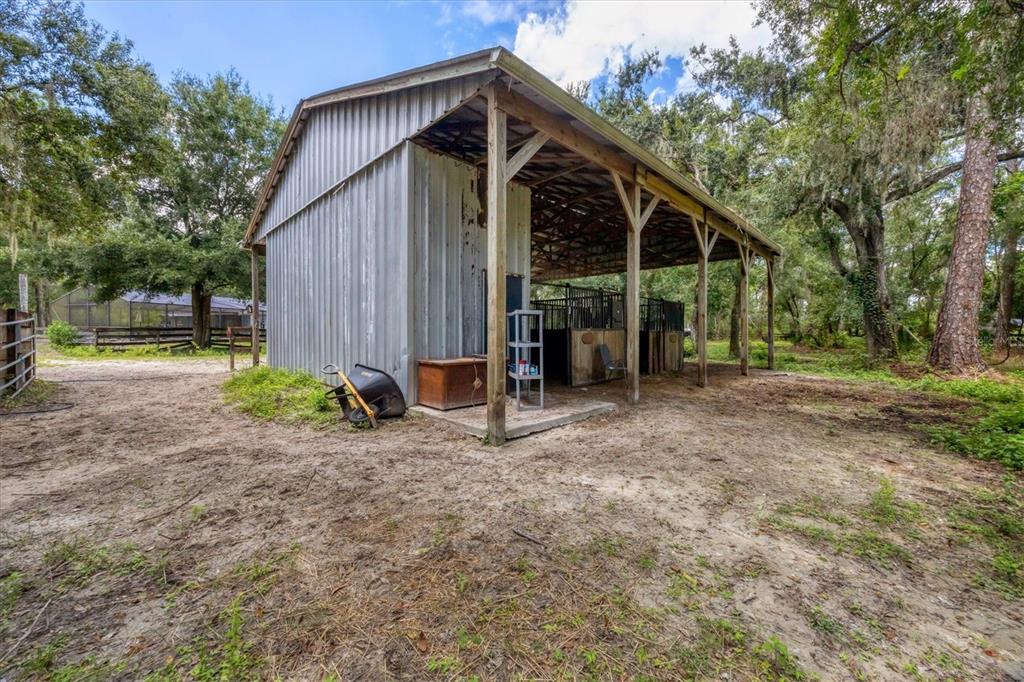18155 Highway 62 Parrish, FL 34219 - Photo 47 of 61 a view of a house with backyard and trees
