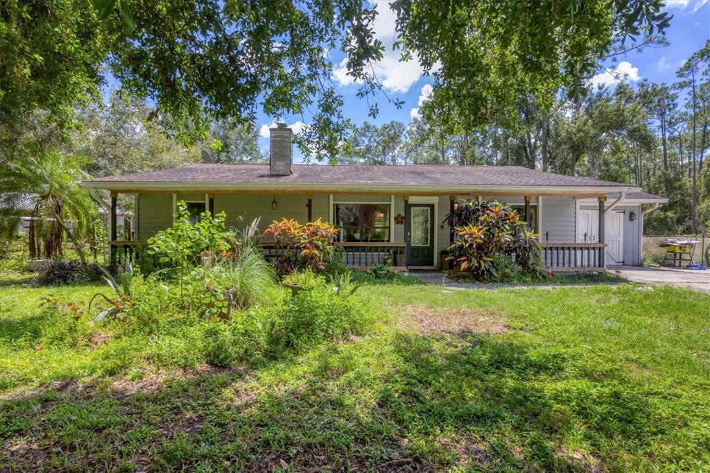 18155 Highway 62 Parrish, FL 34219 - Photo 6 of 61 front view of a house with a big yard