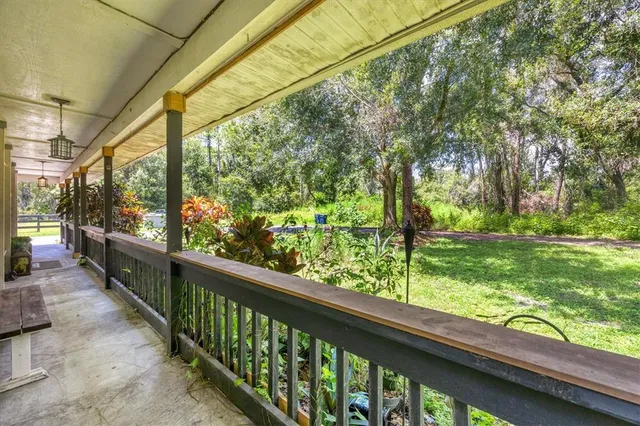 a view of a door and chair in the balcony