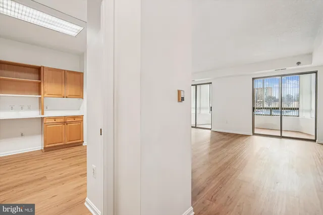 a view of a street with a cars parked in front of it