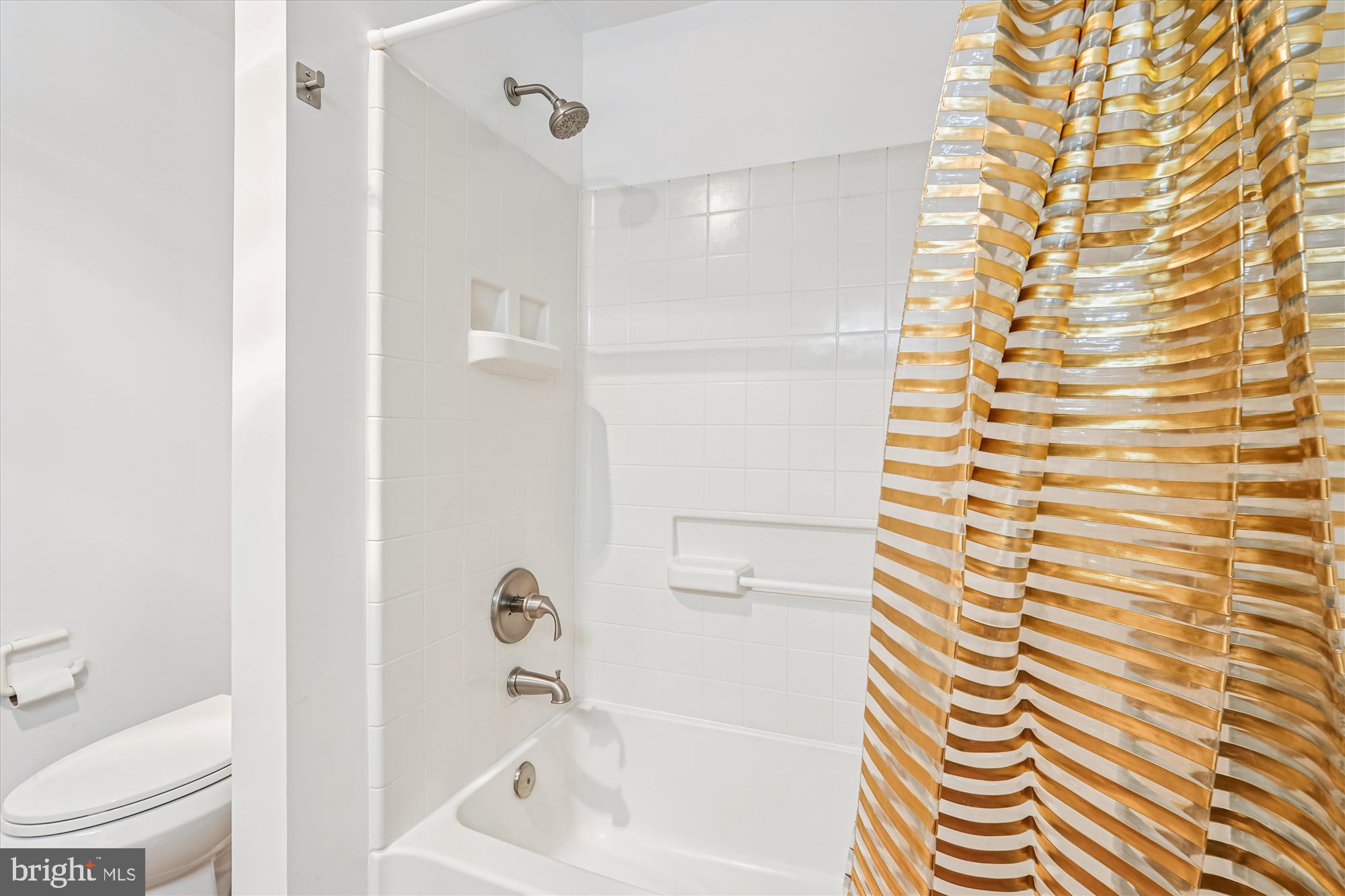 3210 North Leisure World Boulevard, Unit 119 Silver Spring, MD 20906 - Photo 30 of 76 a bathroom with a bathtub and a shower