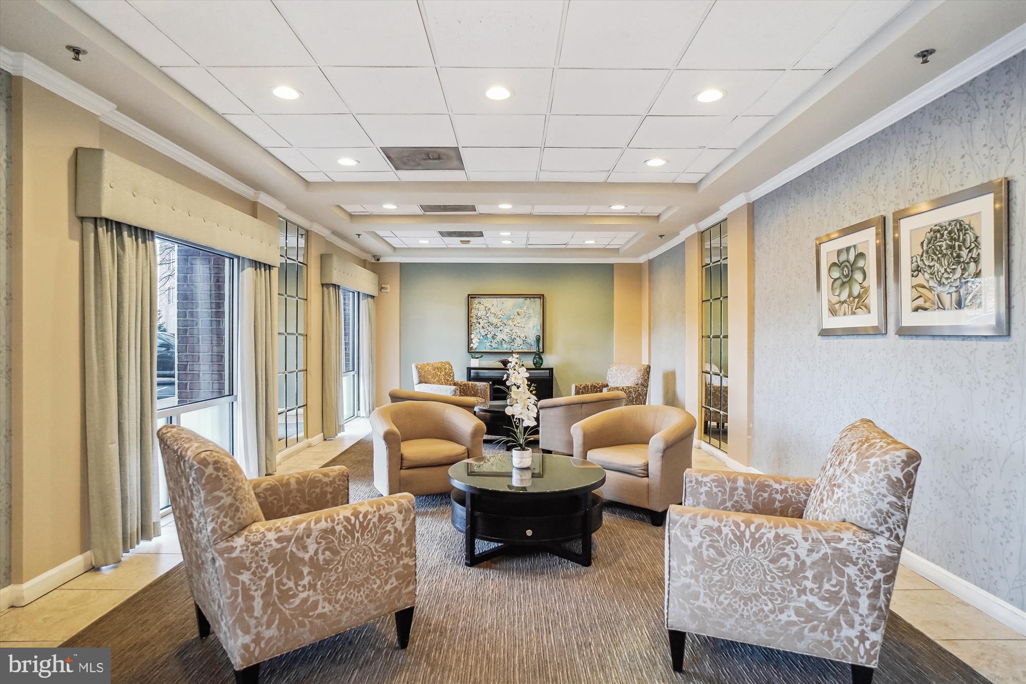 3210 North Leisure World Boulevard, Unit 119 Silver Spring, MD 20906 - Photo 5 of 76 a living room with furniture and a large window
