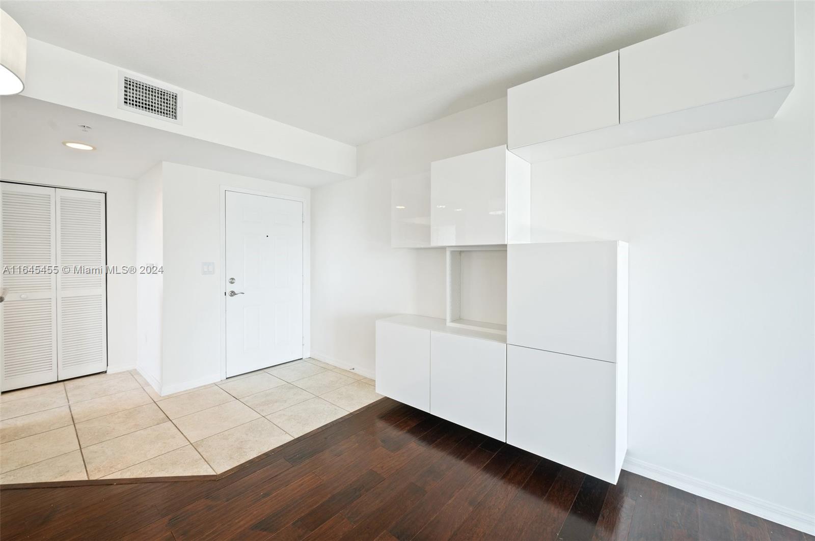 3530 Southwest 22nd Street, Unit 713 Miami, FL 33145 - Photo 19 of 41 an empty room with wooden floor