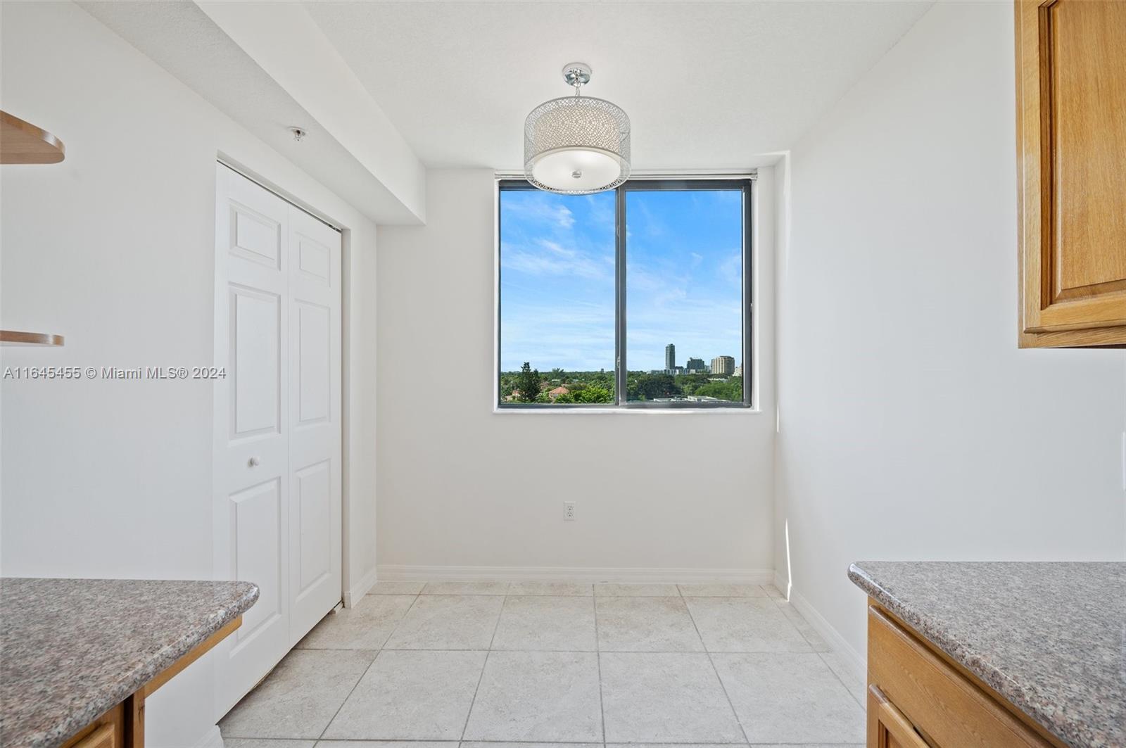 3530 Southwest 22nd Street, Unit 713 Miami, FL 33145 - Photo 23 of 41 an entryway view with wooden floor and chandelier