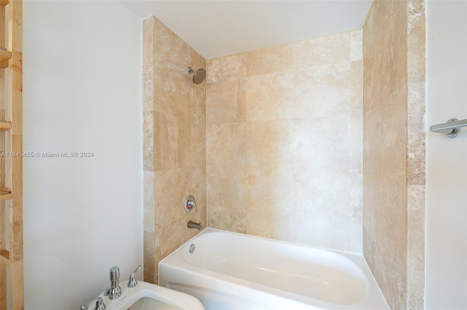 3530 Southwest 22nd Street, Unit 713 Miami, FL 33145 - Photo 32 of 41 a bathroom with a bathtub and shower