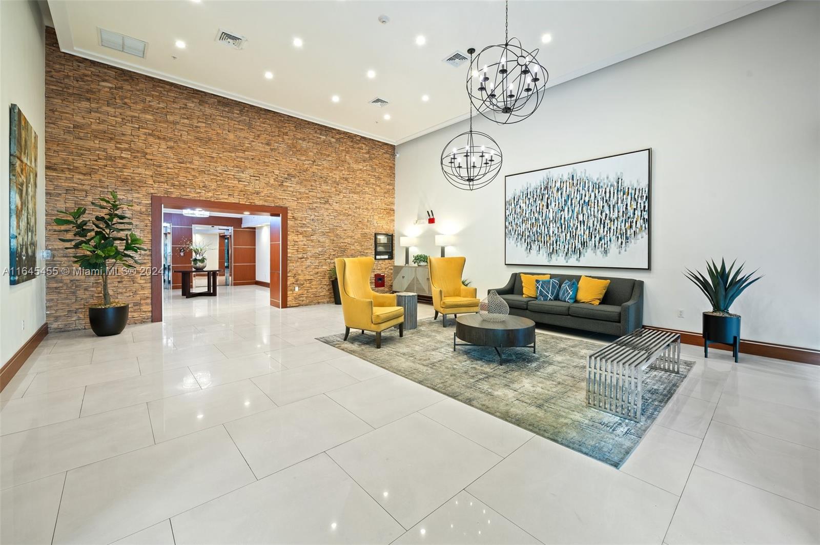 3530 Southwest 22nd Street, Unit 713 Miami, FL 33145 - Photo 4 of 41 a living room with fireplace furniture and a chandelier