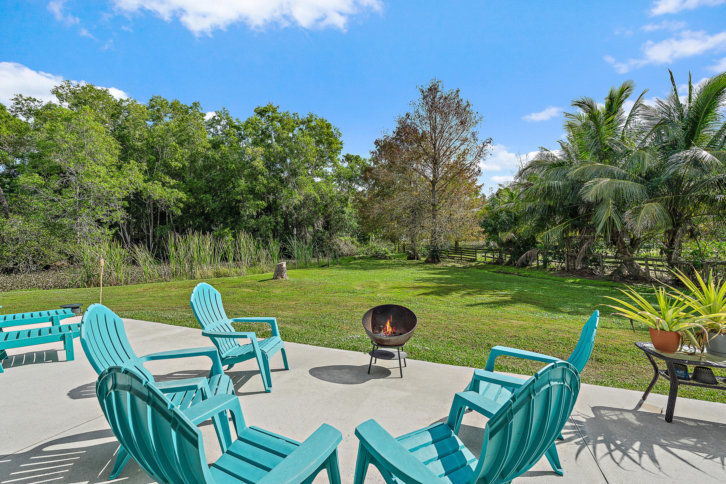 17696 Winterhawk Trail Jupiter, FL 33478 - Photo 1 of 21 a view of yard with seating area and trees around