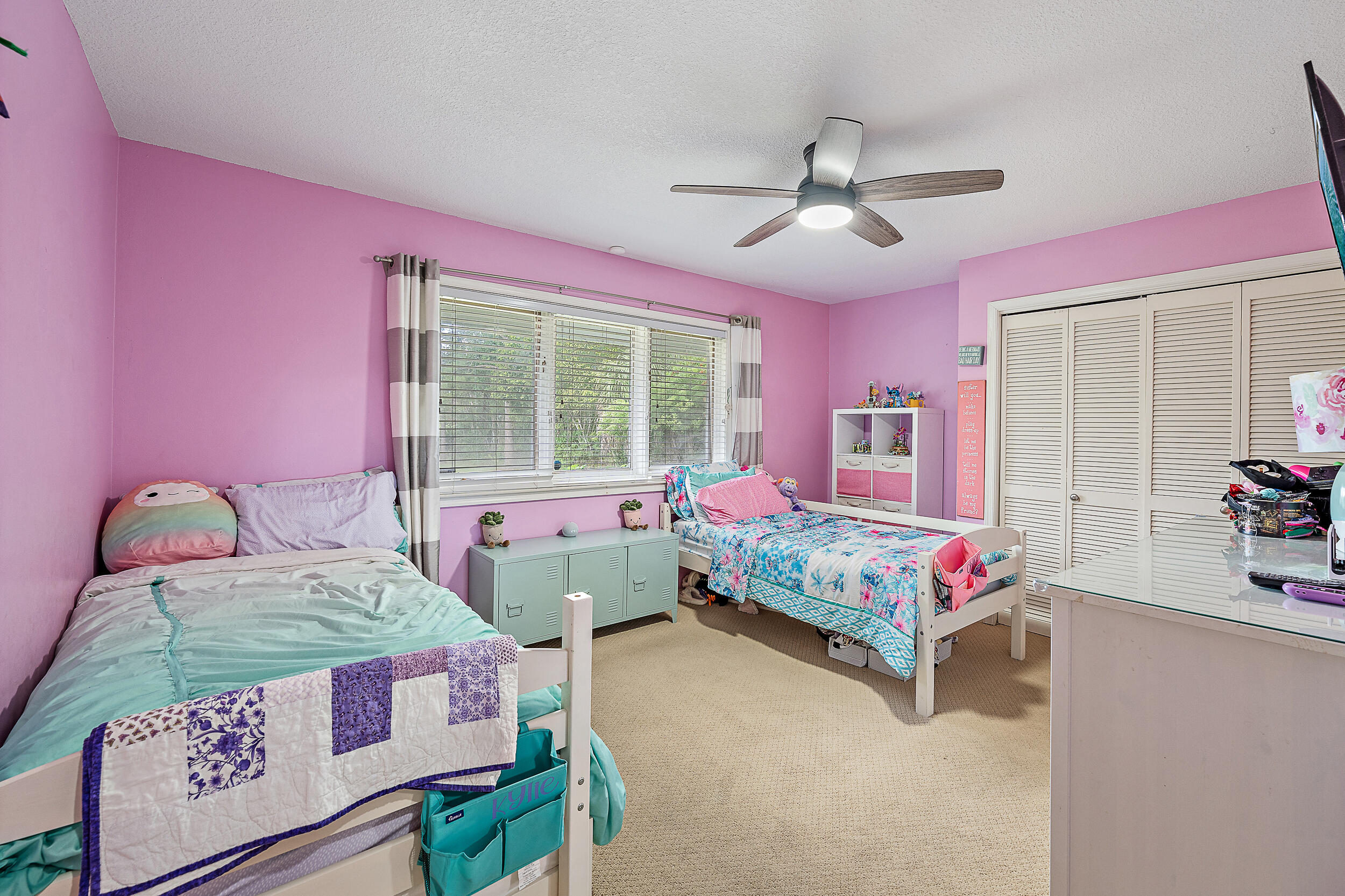 17696 Winterhawk Trail Jupiter, FL 33478 - Photo 12 of 21 a bedroom with a bed dresser and a window