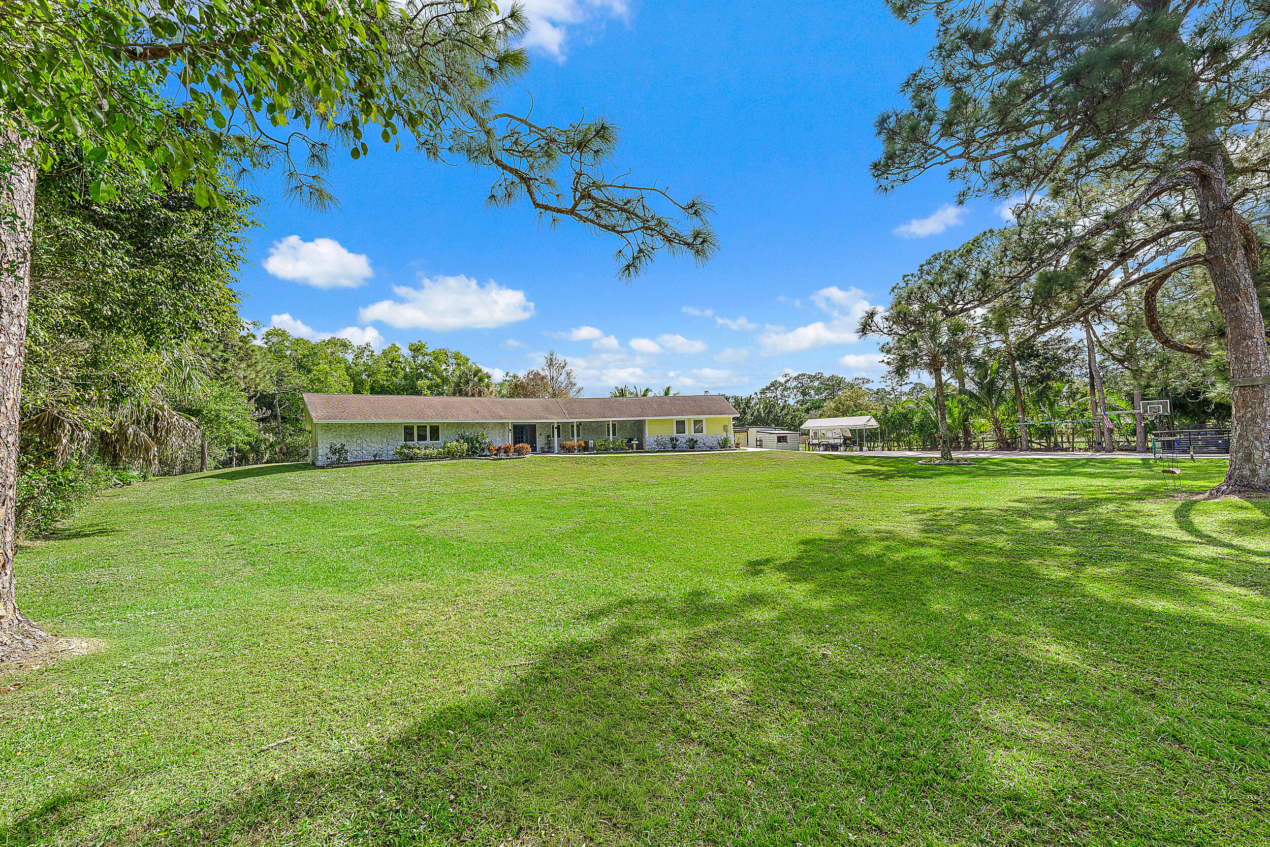 17696 Winterhawk Trail Jupiter, FL 33478 - Photo 15 of 21 a view of an house with a yard