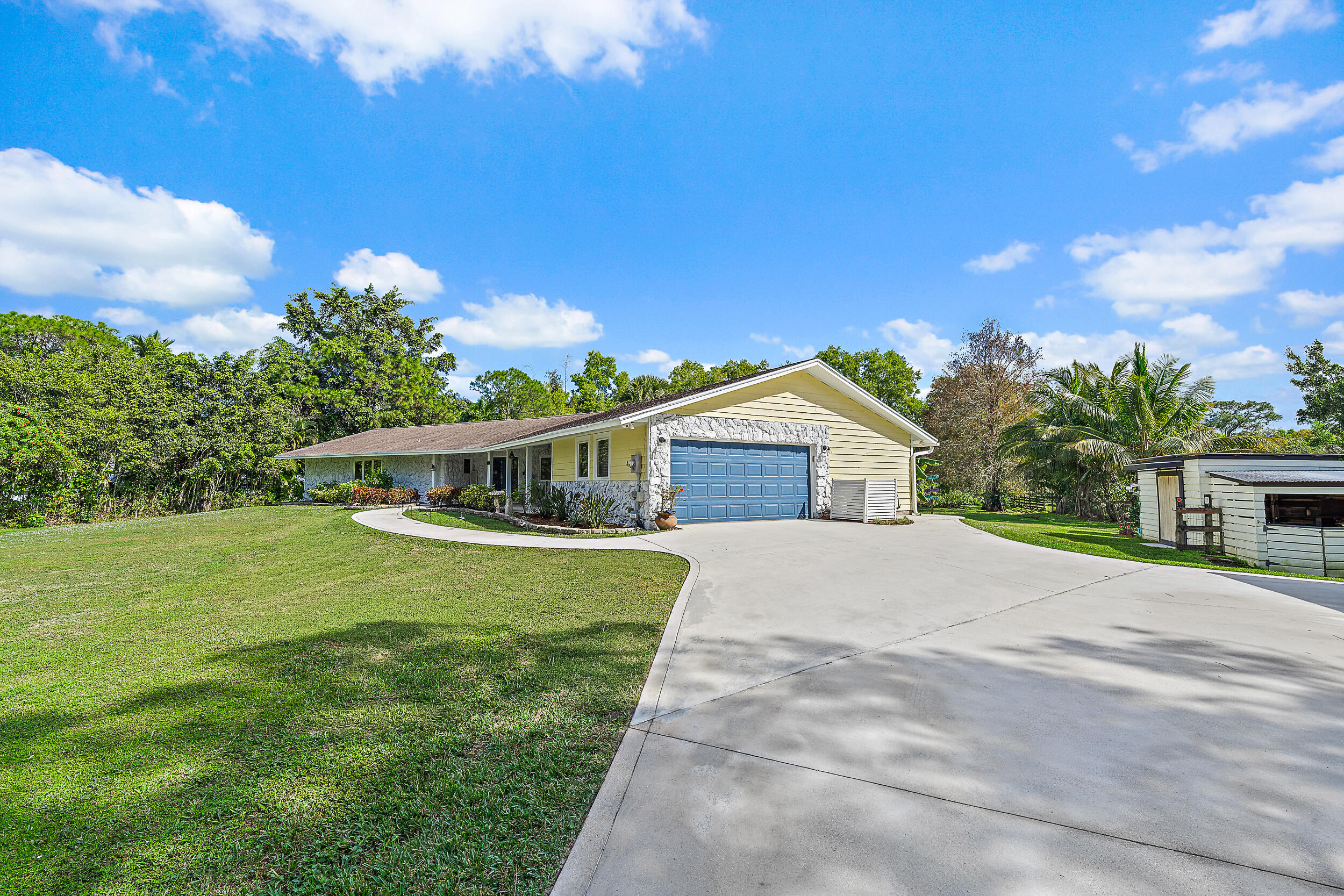 17696 Winterhawk Trail Jupiter, FL 33478 - Photo 17 of 21 a front view of a house with a yard