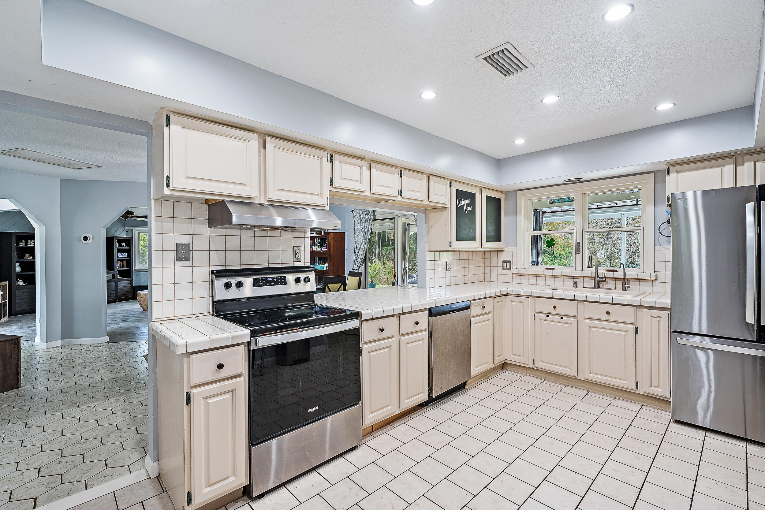 17696 Winterhawk Trail Jupiter, FL 33478 - Photo 7 of 21 a kitchen with granite countertop appliances cabinets and a sink