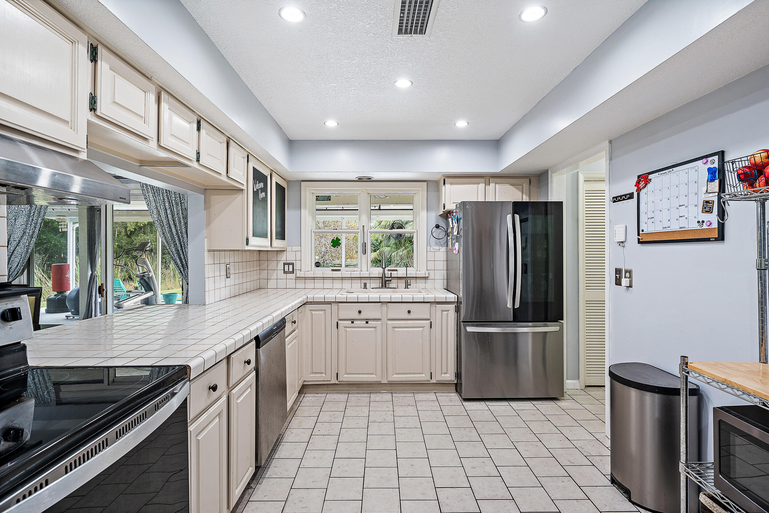 17696 Winterhawk Trail Jupiter, FL 33478 - Photo 8 of 21 a kitchen with a sink stainless steel appliances and cabinets