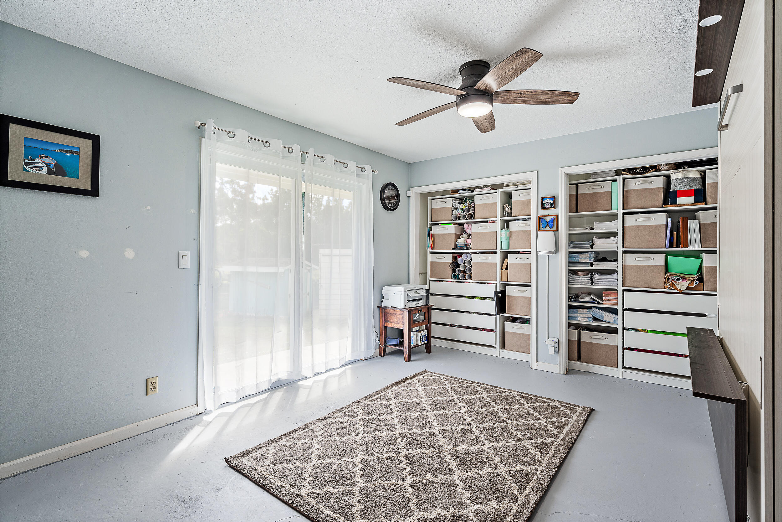 17696 Winterhawk Trail Jupiter, FL 33478 - Photo 9 of 21 a living room with a furniture and a book shelf