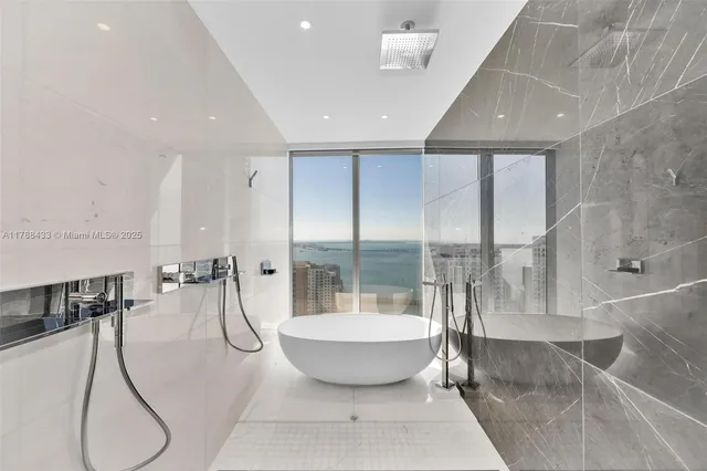 a bathroom with a double vanity sink mirror and double