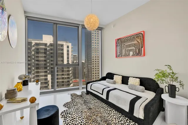 a bedroom with bed and window