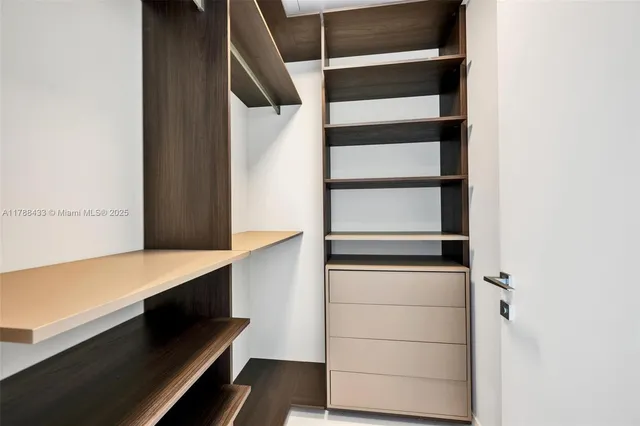a bathroom with a double vanity sink toilet and shower