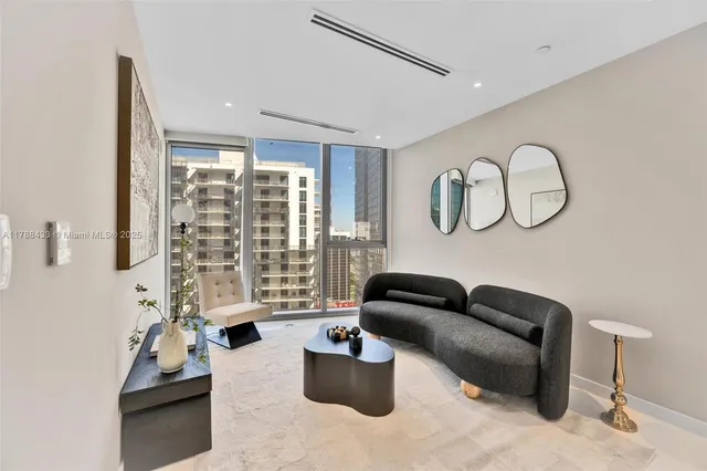 a spacious bedroom with a bed and a large window